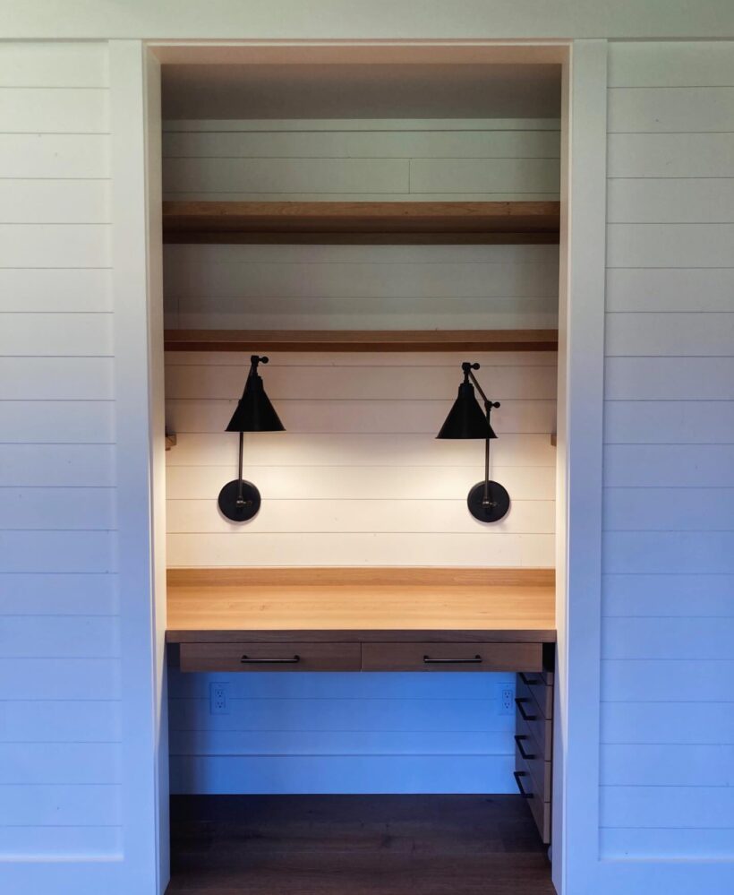 view of custom wood desk and lamps